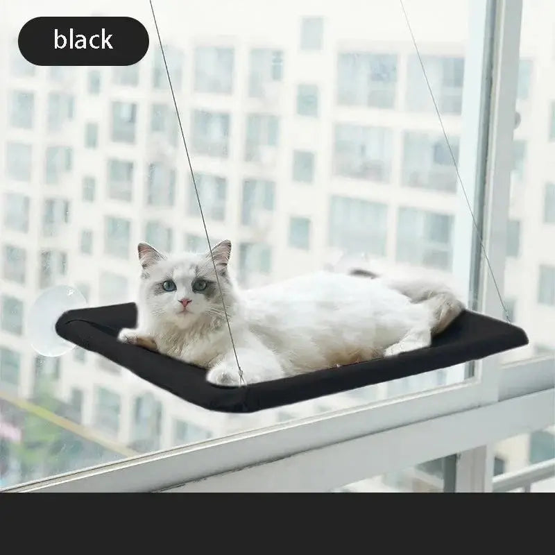 Cat Window Hammock installed on a sunny windowsill at home