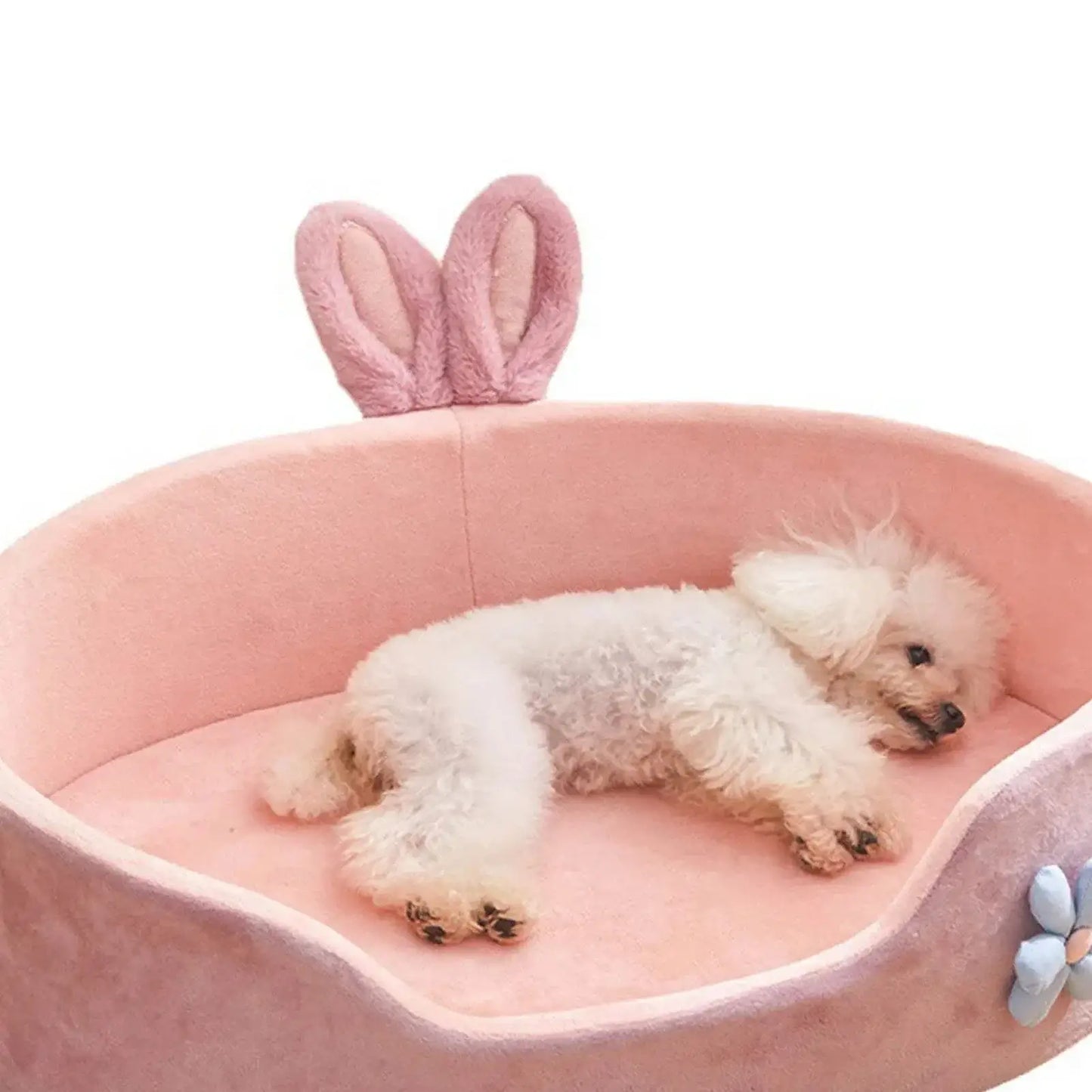 Washable Pet Bed in pink with a small dog resting inside