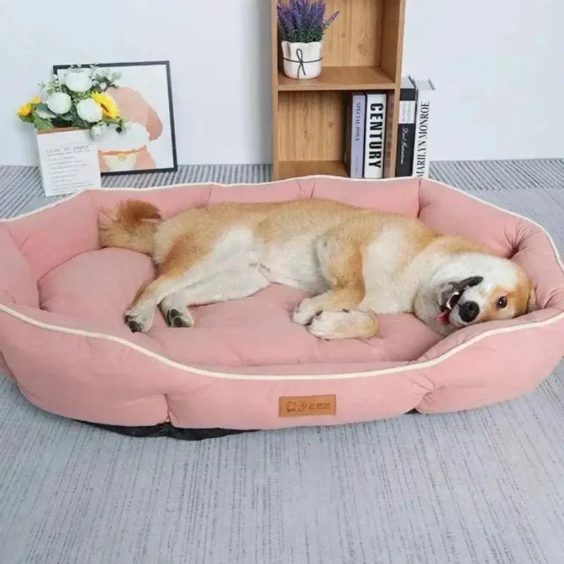 How to Choose The Best Pet Bed for Your Dog or Cat - Dog lounging in a pink pet bed.
