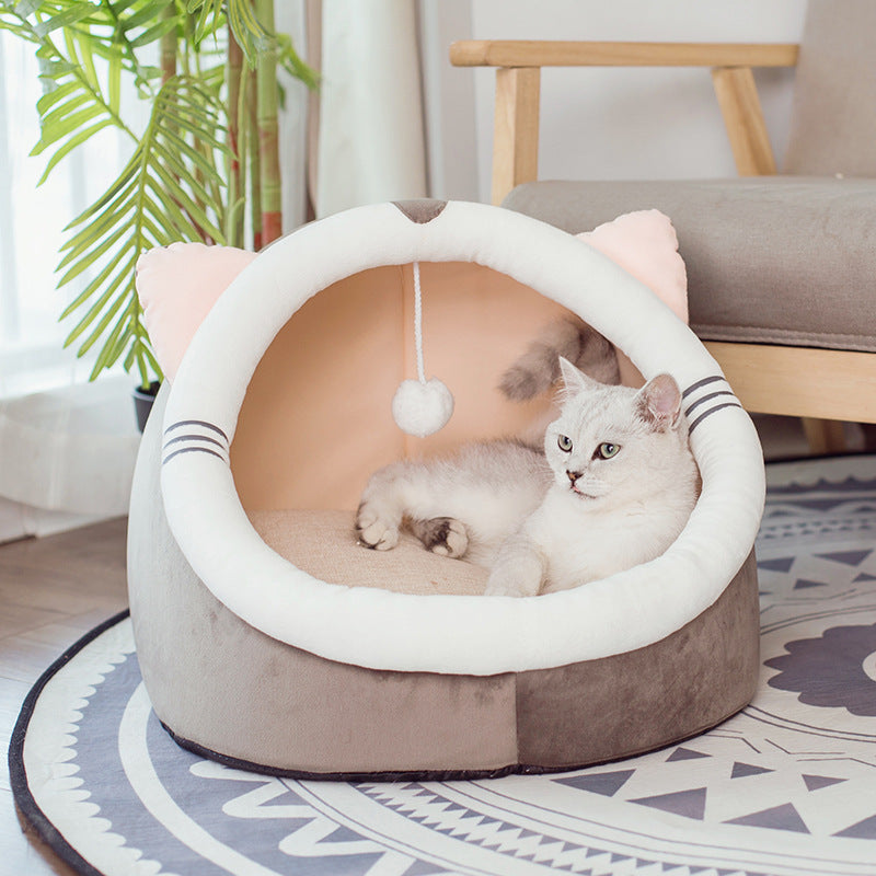 Foldable cat bed cave in soft PP cotton with a tabby kitten sleeping inside