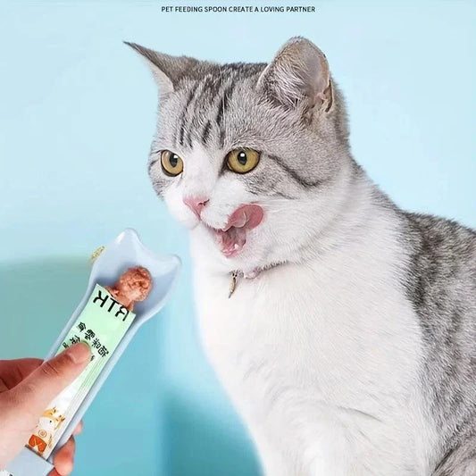 Cat Strip Feeder Spoon dispensing wet treat to a cat