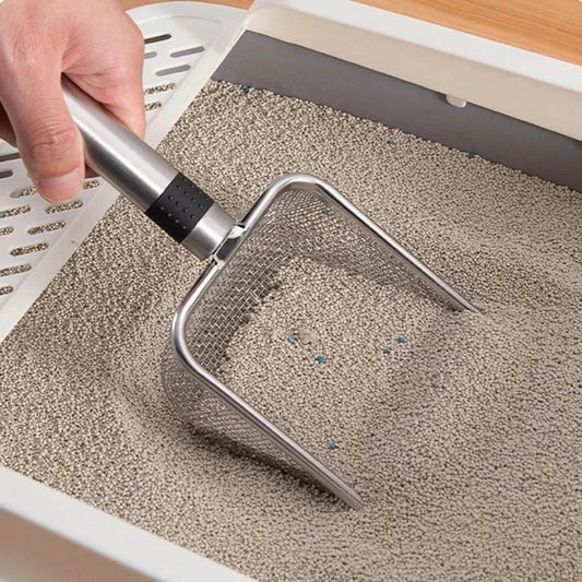 Stainless Steel Litter Scoop cleaning a cat litter box
