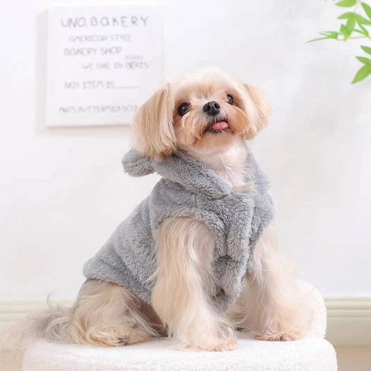 Rabbit Ear Cat Hoodie in pink on a Sphinx cat lounging indoors