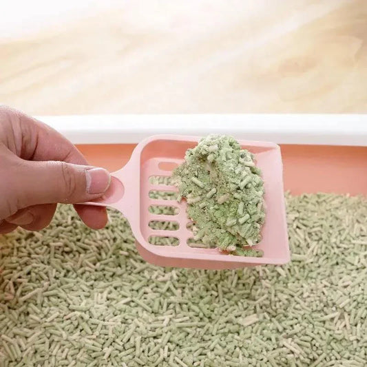 Cat Litter Shovel scooping waste from a litter box