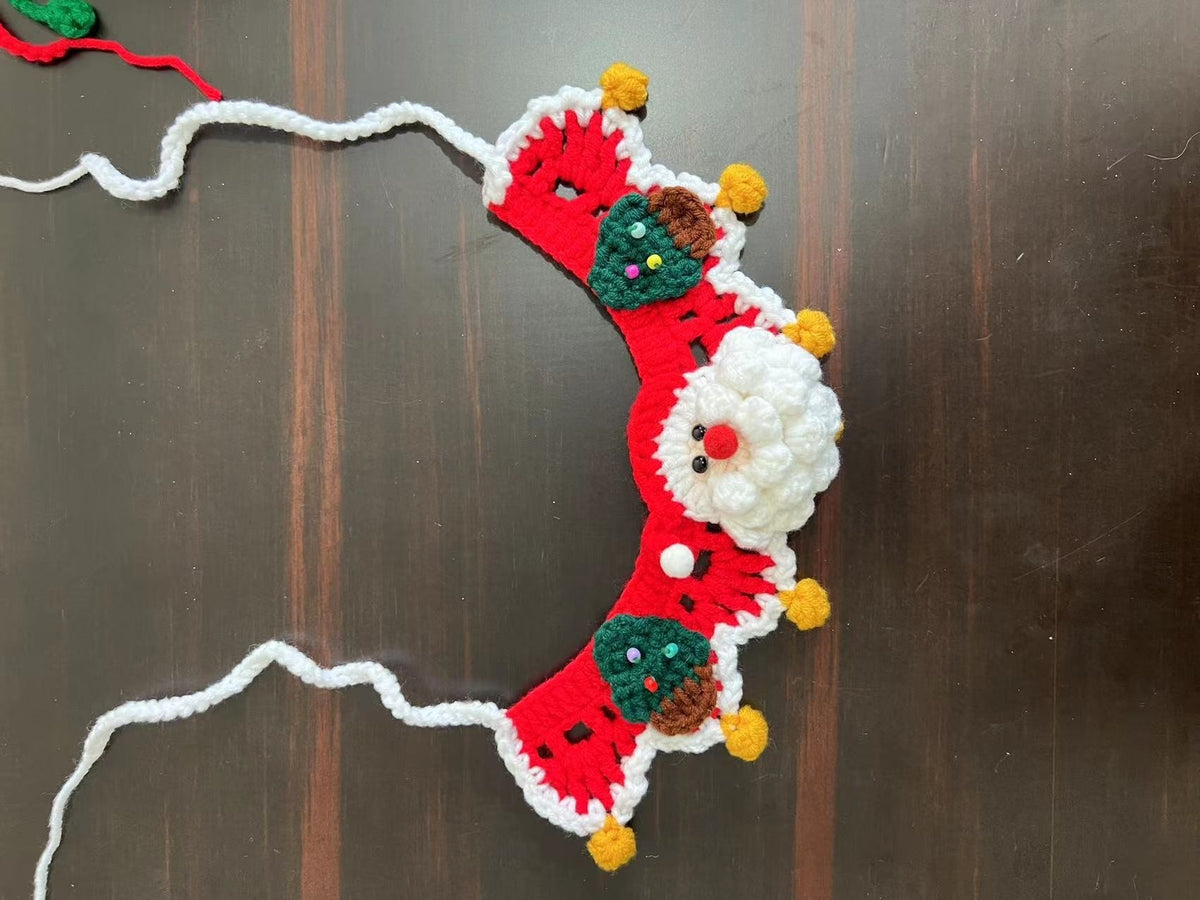 Christmas pet collar with green lace and red tulip pattern worn by a fluffy cat