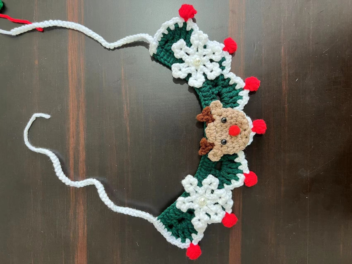Christmas pet collar with green lace and red tulip pattern worn by a fluffy cat