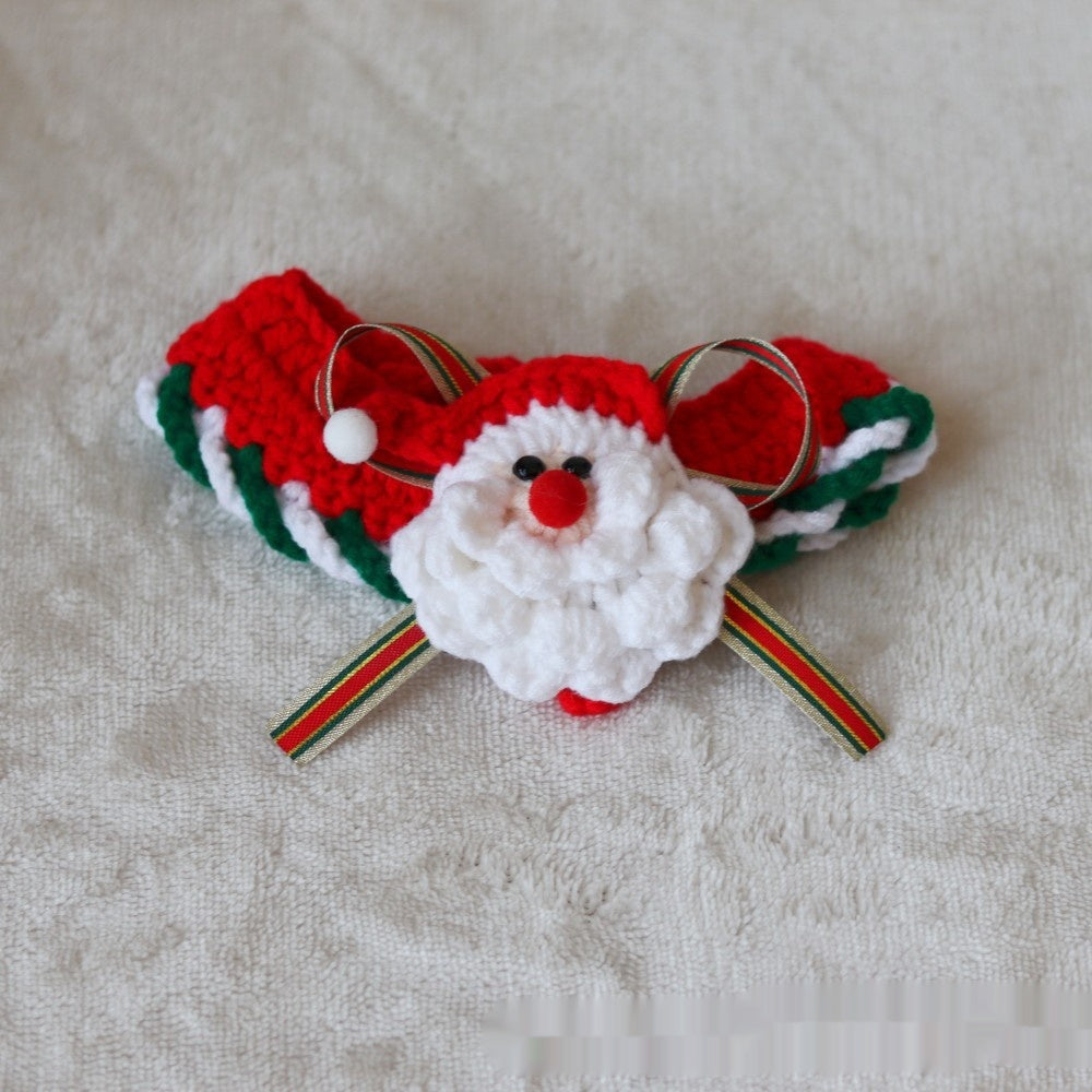 Christmas pet collar with green lace and red tulip pattern worn by a fluffy cat